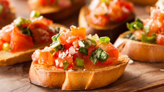 A display of crostini - salsa on a toasted baguette slice