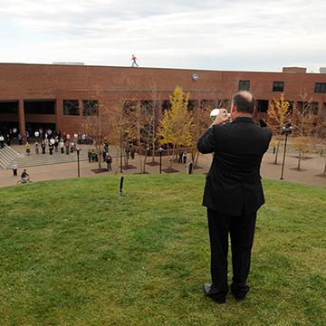 Veteran playing Taps on a bugle