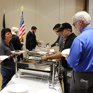 Veteran employees in line at the lunch buffet