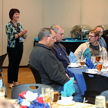 Kena Zumalt, Program Director, Veteran Services, addresses luncheon attendees